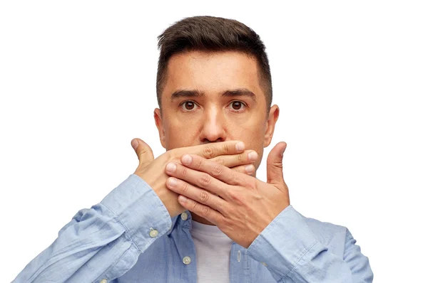 Face of man covering his mouth with hand palm — Stock Photo, Image