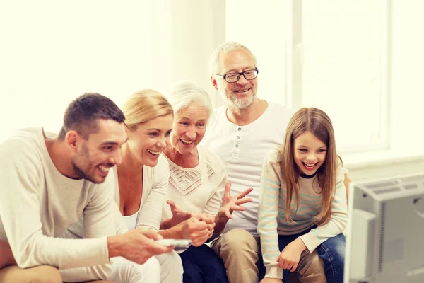 Happy family watching tv at home — Stock Photo, Image