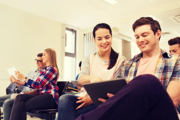 Group of smiling students with tablet pc — Stock Photo, Image