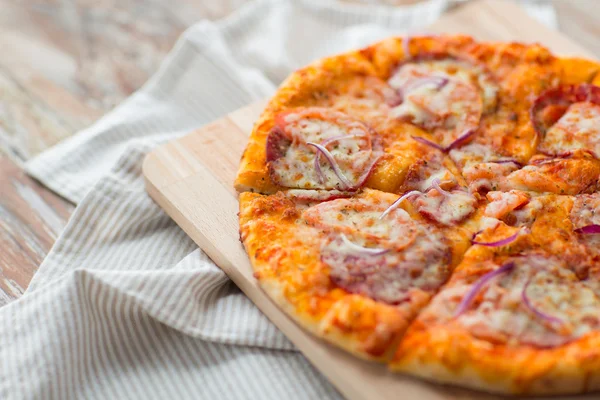 Close up of homemade pizza on wooden table — Stock Photo, Image