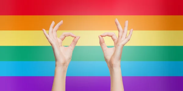 Hands showing ok sign over rainbow background — Stok fotoğraf