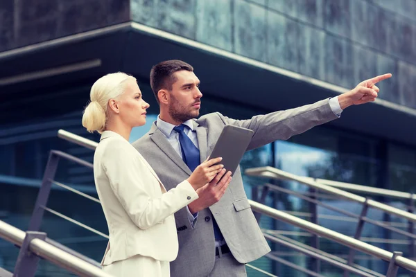 Serious businessmen with tablet pc outdoors — Stock Photo, Image