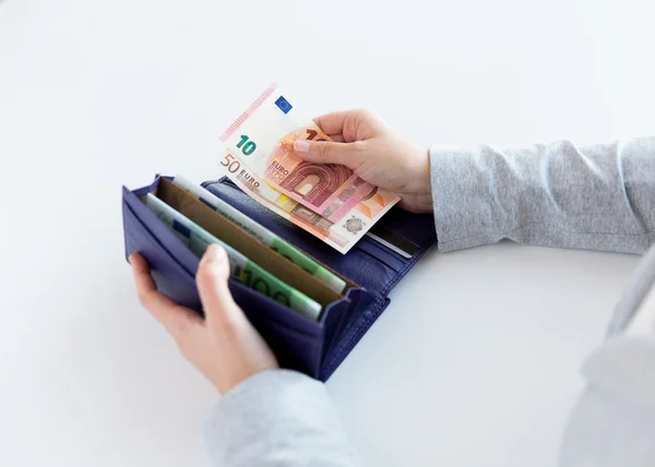 Close up of woman hands with wallet and euro money — Stock Photo, Image