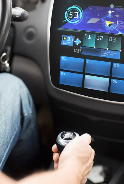 Hand on gearshift and car navigation system — 스톡 사진