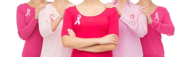 Close up of women with cancer awareness ribbons — Stock Photo, Image