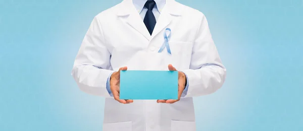 Doctor with prostate cancer awareness ribbon — Stock Photo, Image