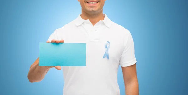 Man with prostate cancer awareness ribbon and card — Stock Photo, Image