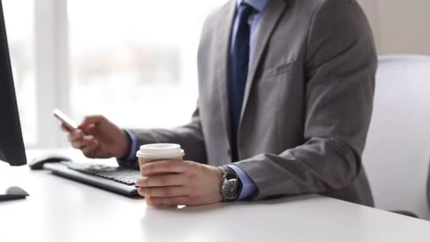 Close up of businessman with smartphone and coffee — Stock Video