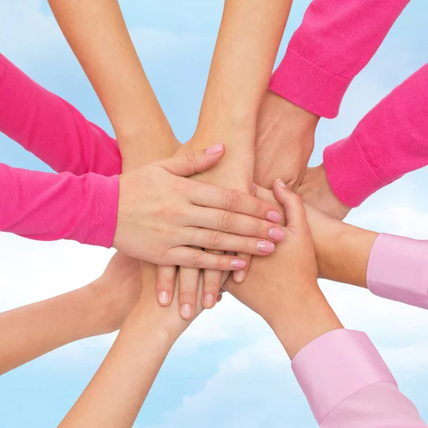 Close up of women with hands on top — Stock Photo, Image