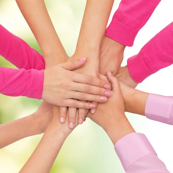 Close up of women with hands on top — Stock Photo, Image