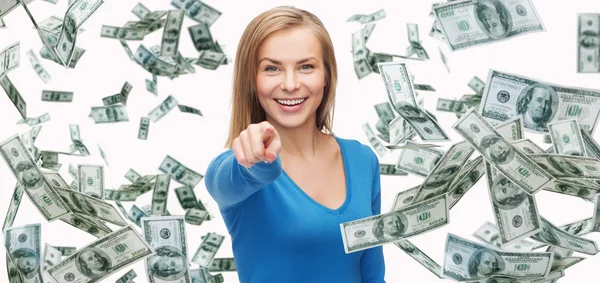 Smiling woman with money pointing finger on you — Stok fotoğraf