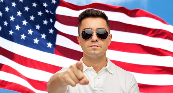 Man pointing on you over american flag background — Stok fotoğraf