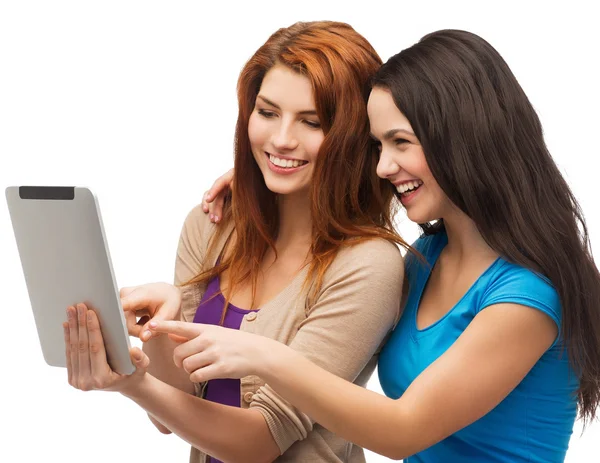 Two smiling teenagers with tablet pc computer — Stock Photo, Image