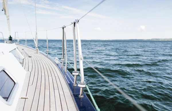 Close up of sailboat or sailing yacht deck and sea — Stock Photo, Image