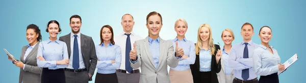 Group of happy businesspeople showing thumbs up — Stock Photo, Image