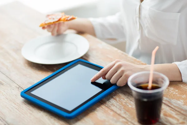 Close up of woman with tablet pc having dinner — Stock fotografie