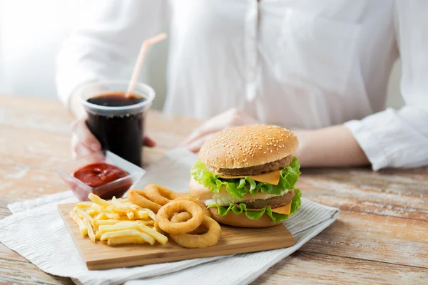 Close up of woman with fast food and cocacola — 스톡 사진