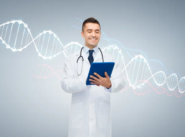 Happy male doctor with tablet pc and dna molecule — Stock fotografie