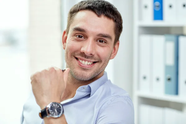 Portrait of smiling businessman in office — Stock Photo, Image