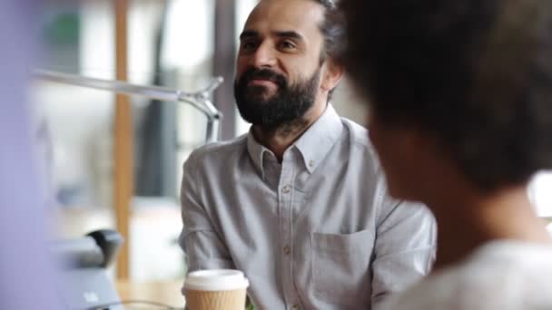 Happy creative team with coffee talking in office — Stock Video