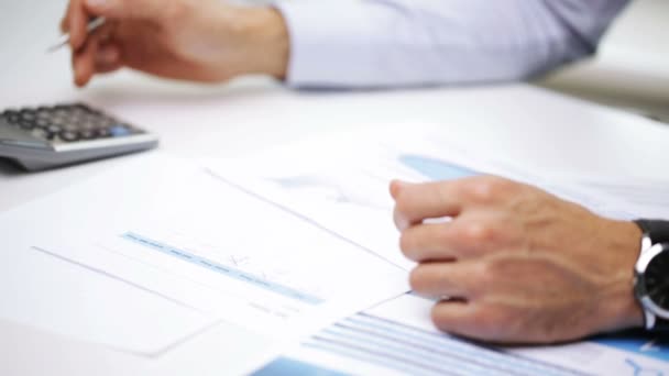 Businessman hands with calculator and papers — Stock Video