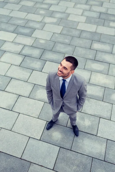 Young smiling businessman outdoors from top — Stock Photo, Image