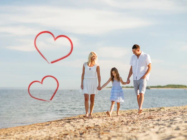 Happy family walking at the seaside — Stock Photo, Image