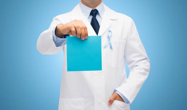 Doctor with prostate cancer awareness ribbon — Stock Photo, Image