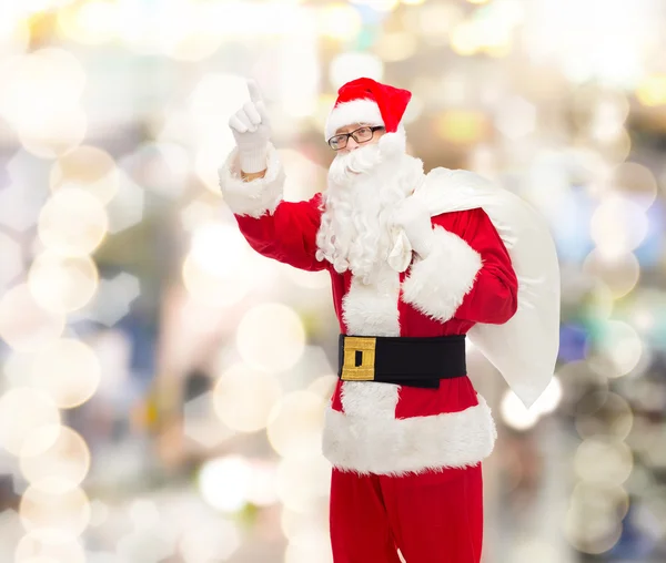 Homme en costume de Père Noël claus avec sac — Photo