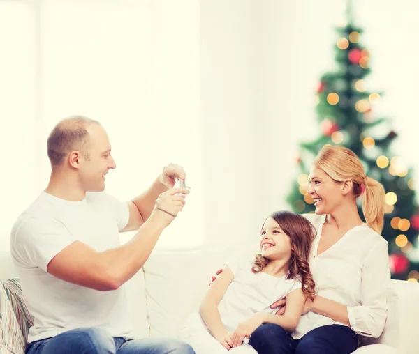 Happy family with camera at home — Stock Photo, Image