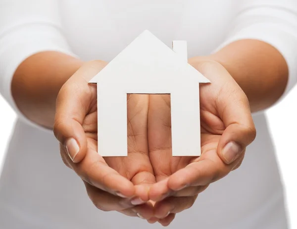Woman hands with paper house — Stock Photo, Image