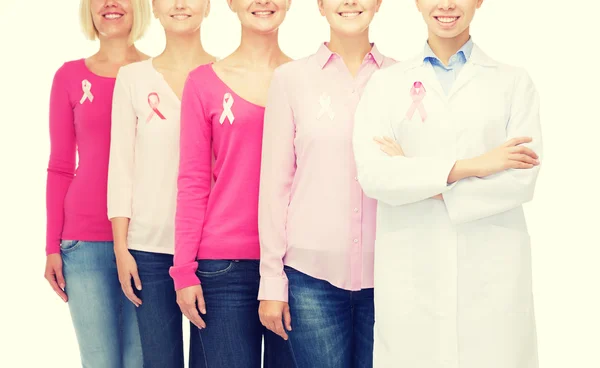 Close up of women with cancer awareness ribbons — Stock Photo, Image