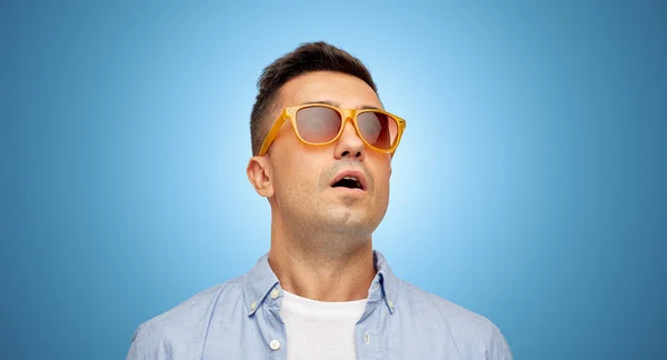 Face of scared man in shirt and sunglasses — Stock Photo, Image