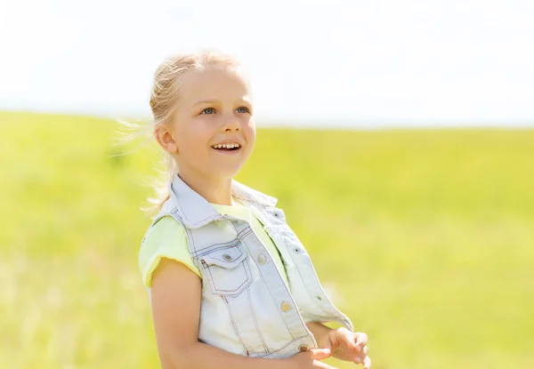 Happy little girl outdoors at summer — Stock Photo, Image