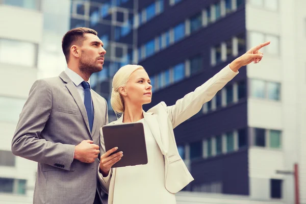 Serious businessmen with tablet pc outdoors — Stock Photo, Image