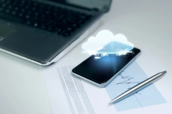 Close up of smartphone with cloud icon projection — Stock Photo, Image