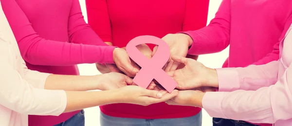 Close up of women with cancer awareness ribbons — Stock Photo, Image