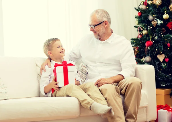 Smiling grandfather and grandson at home — Stock Photo, Image