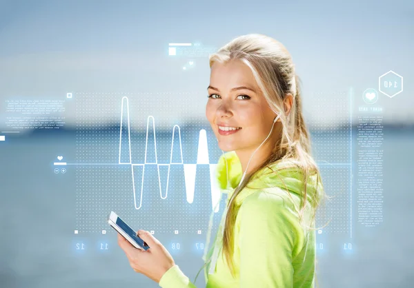 Woman listening to music outdoors — Stock Photo, Image