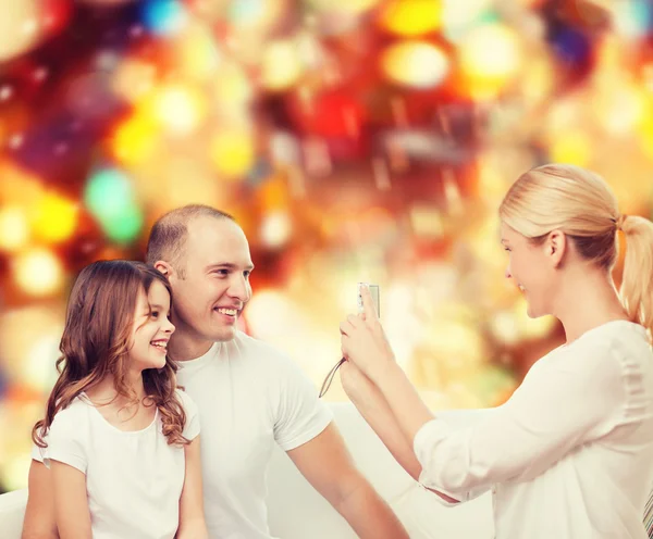 Happy family with camera at home — Stock Photo, Image