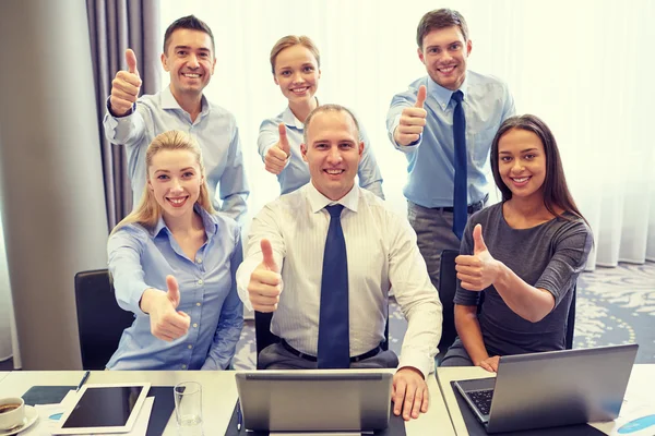 Business people showing thumbs up — Stock Photo, Image