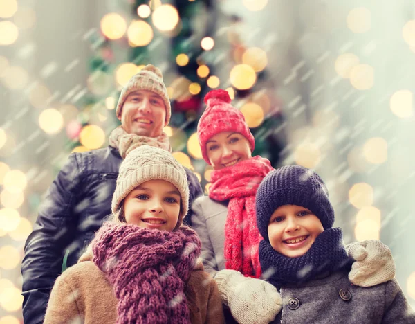 Happy family in winter clothes outdoors — Stock Photo, Image