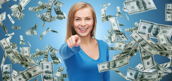 Smiling woman with money pointing finger — Stock Photo, Image