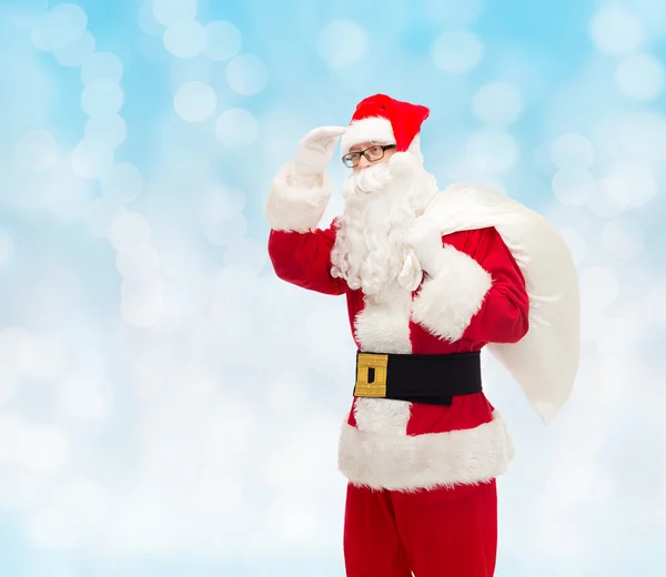 Man in costume of santa claus with bag — Stock Photo, Image