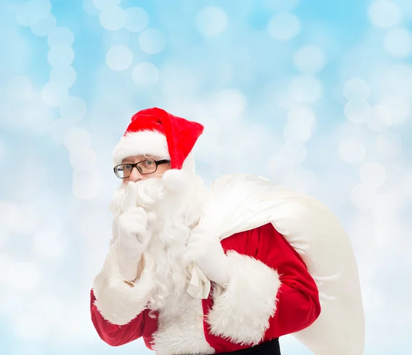 Homem em traje de santa claus com saco — Fotografia de Stock