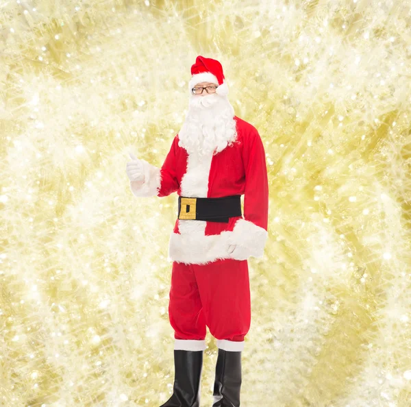 Man in costume of santa claus showing thumbs up — Stock Photo, Image