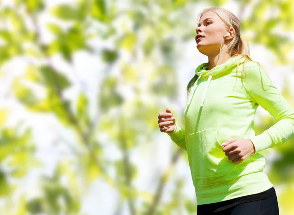 Happy woman running or jogging — Stock Photo, Image