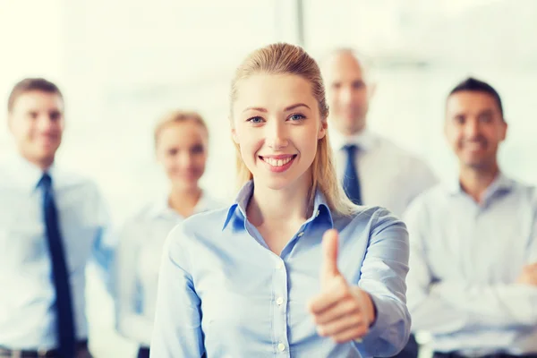 Smiling businesswoman showing thumbs up Royalty Free Stock Photos