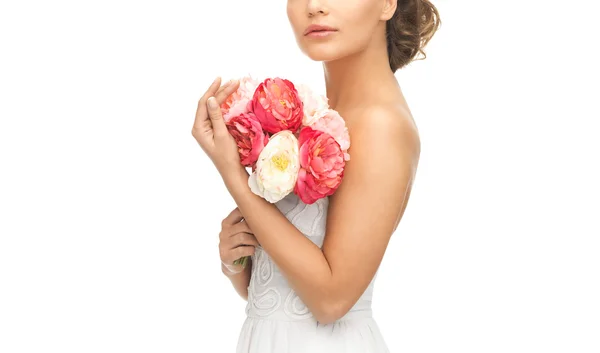 Woman with bouquet of flowers Stock Image