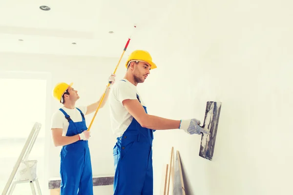 Group of builders with tools indoors — Stock Photo, Image